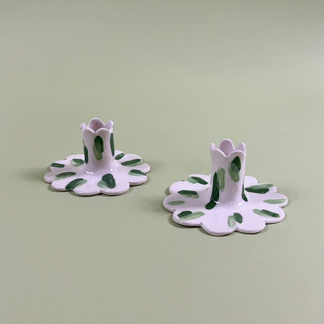 a pair of madcap cottage ceramic candle holders with scalloped edges and a green brushstroke print