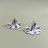 a pair of madcap cottage ceramic candle holders with scalloped edges and a green Club House print