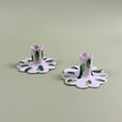 a pair of madcap cottage ceramic candle holders with scalloped edges and a green Club House print