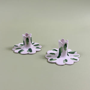 a pair of madcap cottage ceramic candle holders with scalloped edges and a green Club House print