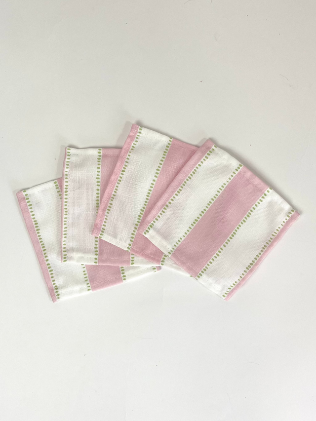 A set of four cotton white and pink stripe coasters in cabana boy print from madcap cottage