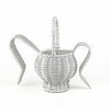 back view of white wicker bunny basket with handle on white background