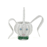 front view of white wicker bunny basket with handle on white background