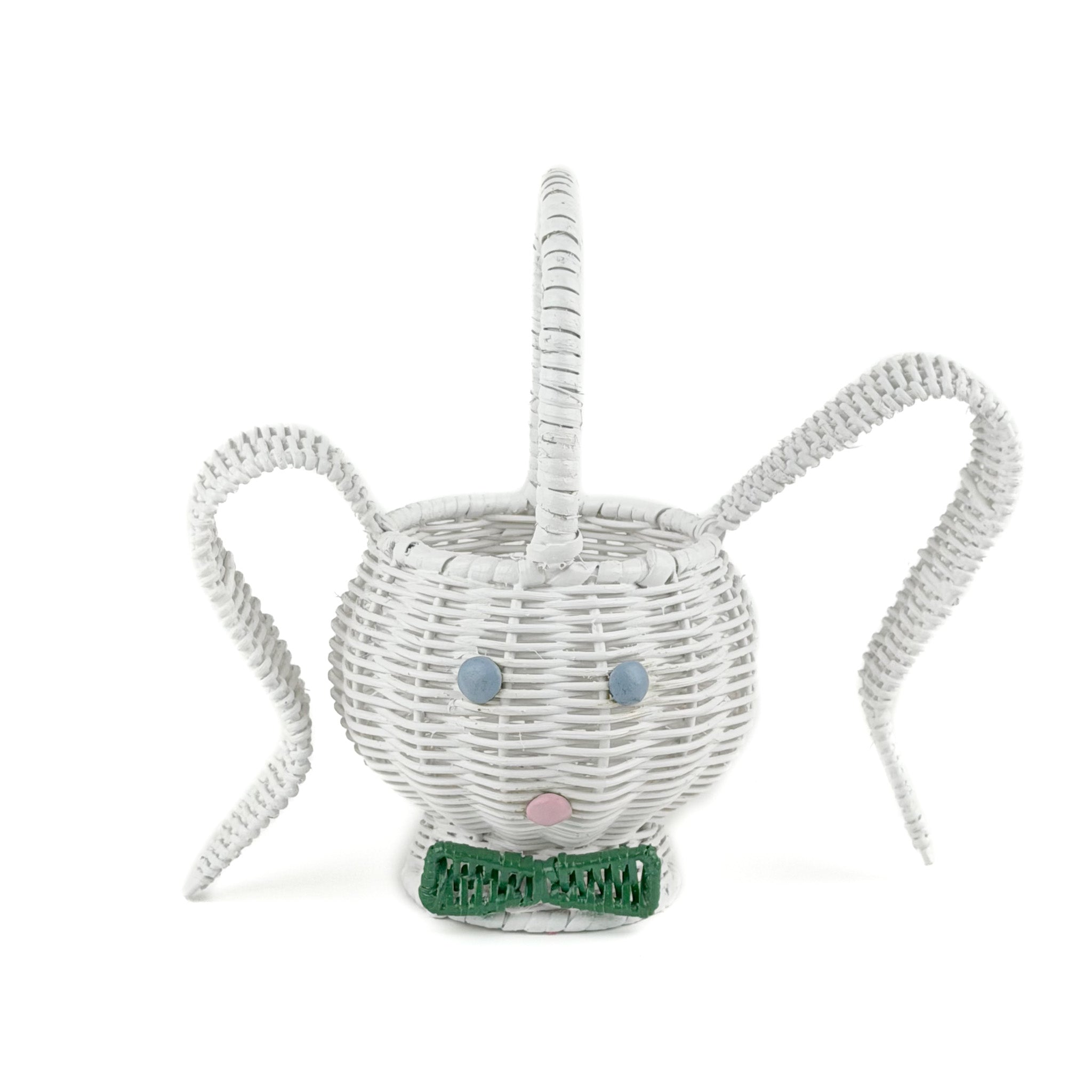 front view of white wicker bunny basket with handle on white background