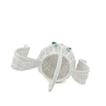 top view of white wicker bunny basket with handle on white background