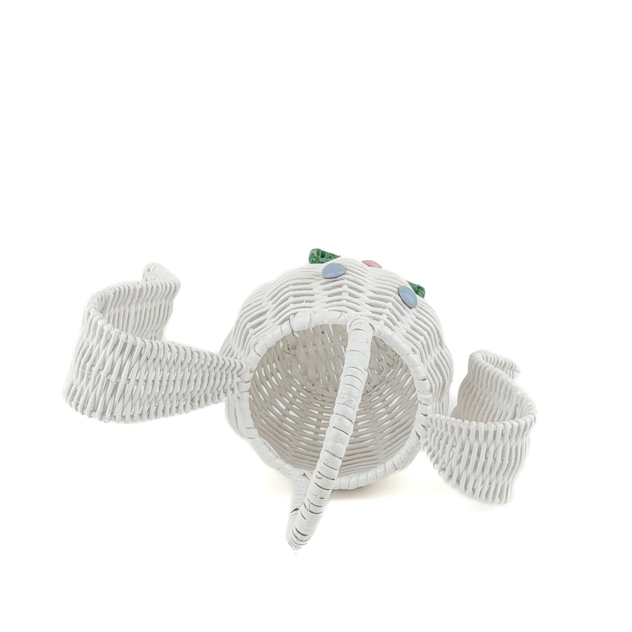 top view of white wicker bunny basket with handle on white background