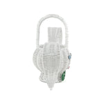 side view of white wicker bunny basket with handle on white background