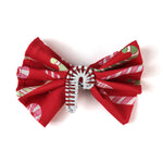 a candy cane napkin inside a candy cane christmas napkin ring