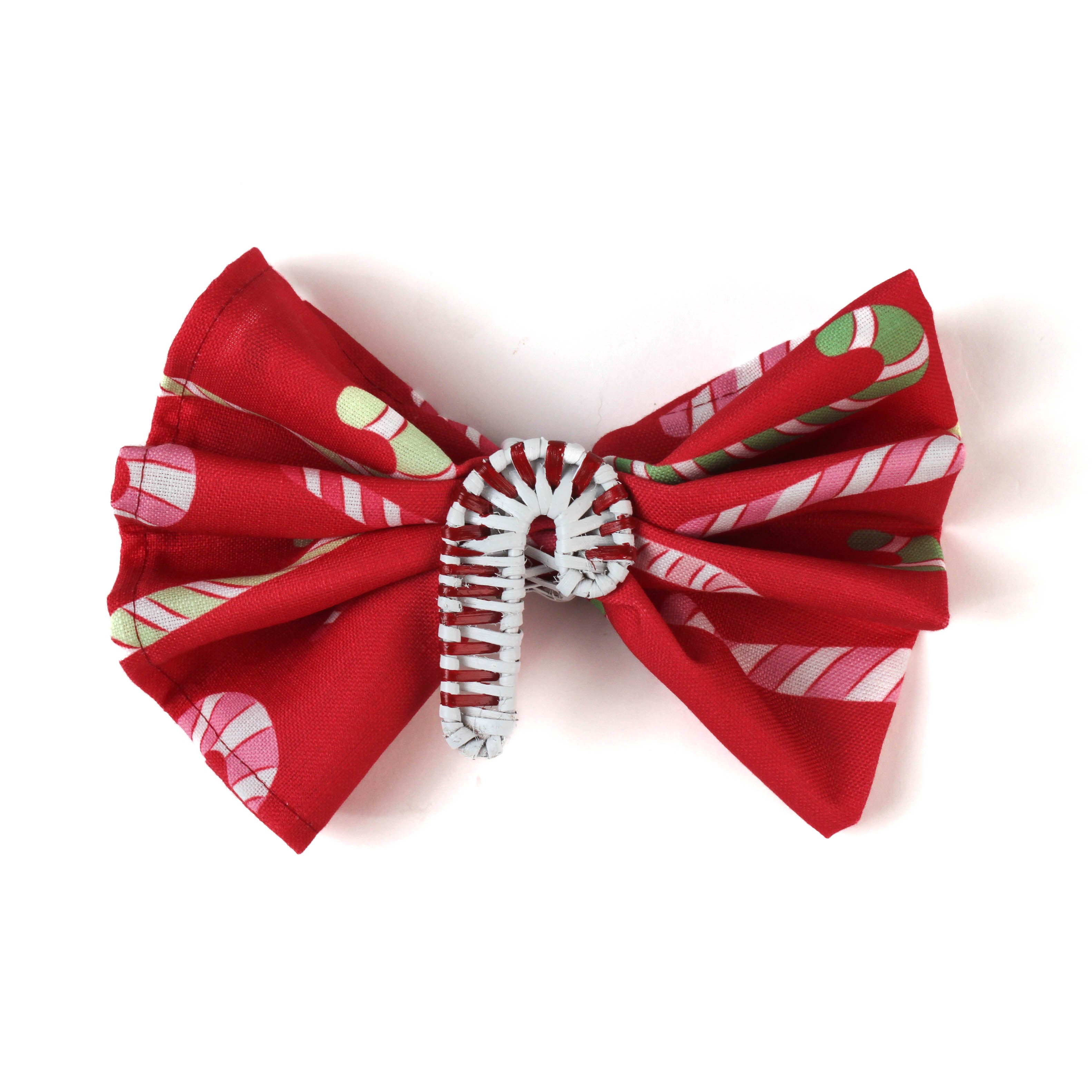a candy cane napkin inside a candy cane christmas napkin ring
