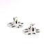 Set of two white ceramic scalloped candle holders with hand-painted green brushstroke accents, designed for taper candles, displayed on a white background.