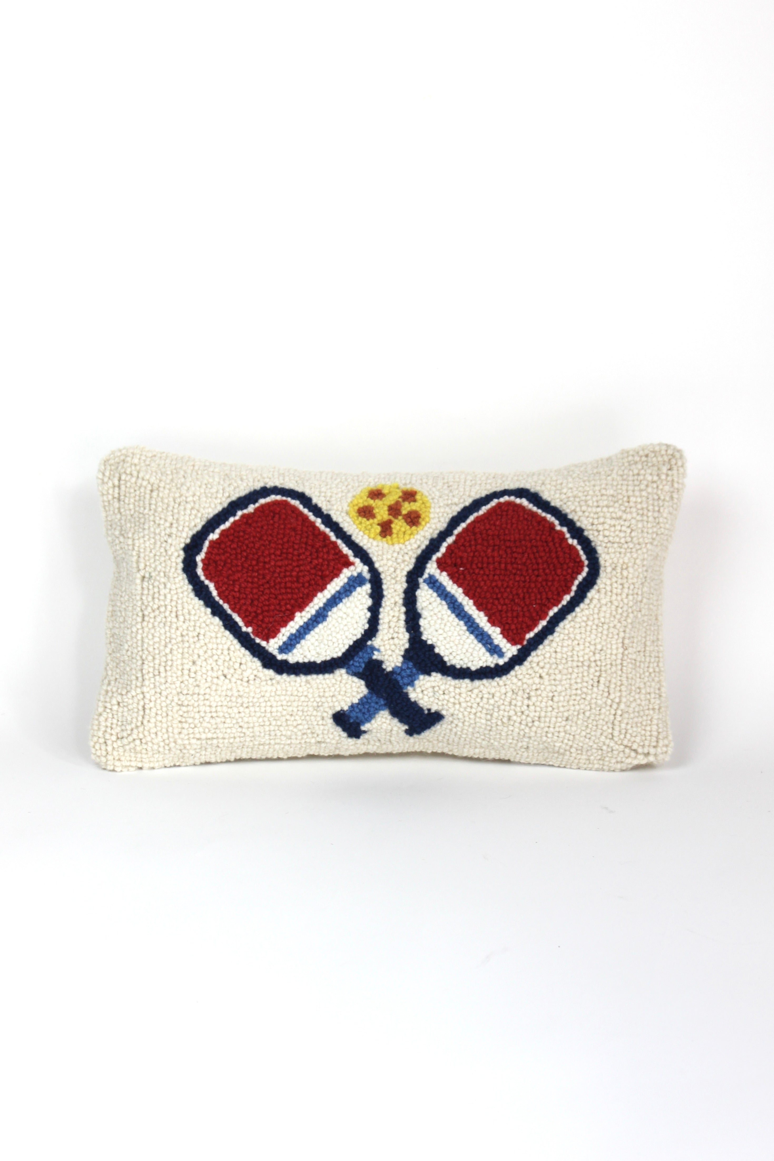 a white pickleball pillow with red paddles from madcap cottage