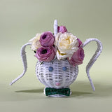 white rattan bunny easter basket with flowers in it