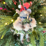 one festive felt mouse ornament dressed in fuzzy holiday outfits and Santa hats holding Christmas wreath