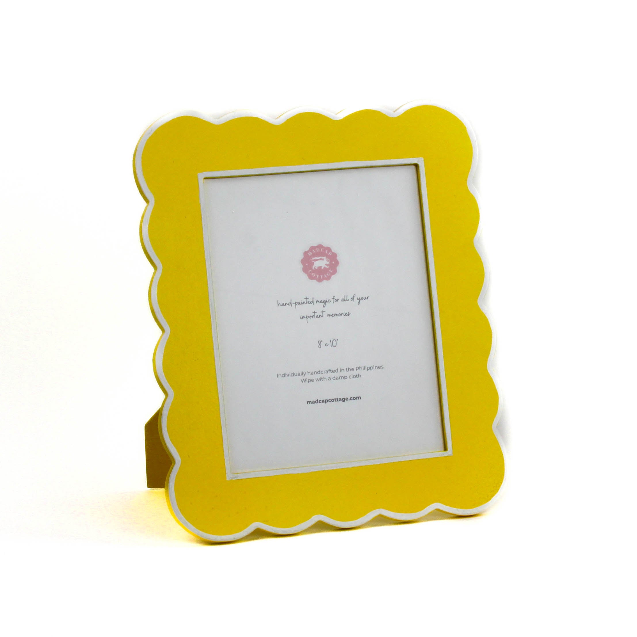 Yellow 8 x 10 scalloped photo frame on a white background