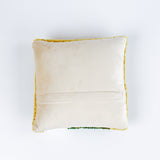 back of a Square decorative pillow with a yellow background featuring a hooked wool design of three purple pansy flowers with green stems and leaves.