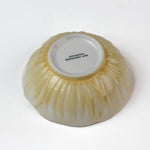 bottow view of a Hand-Painted Yellow Ceramic Flower-Shaped Bowl on a white background