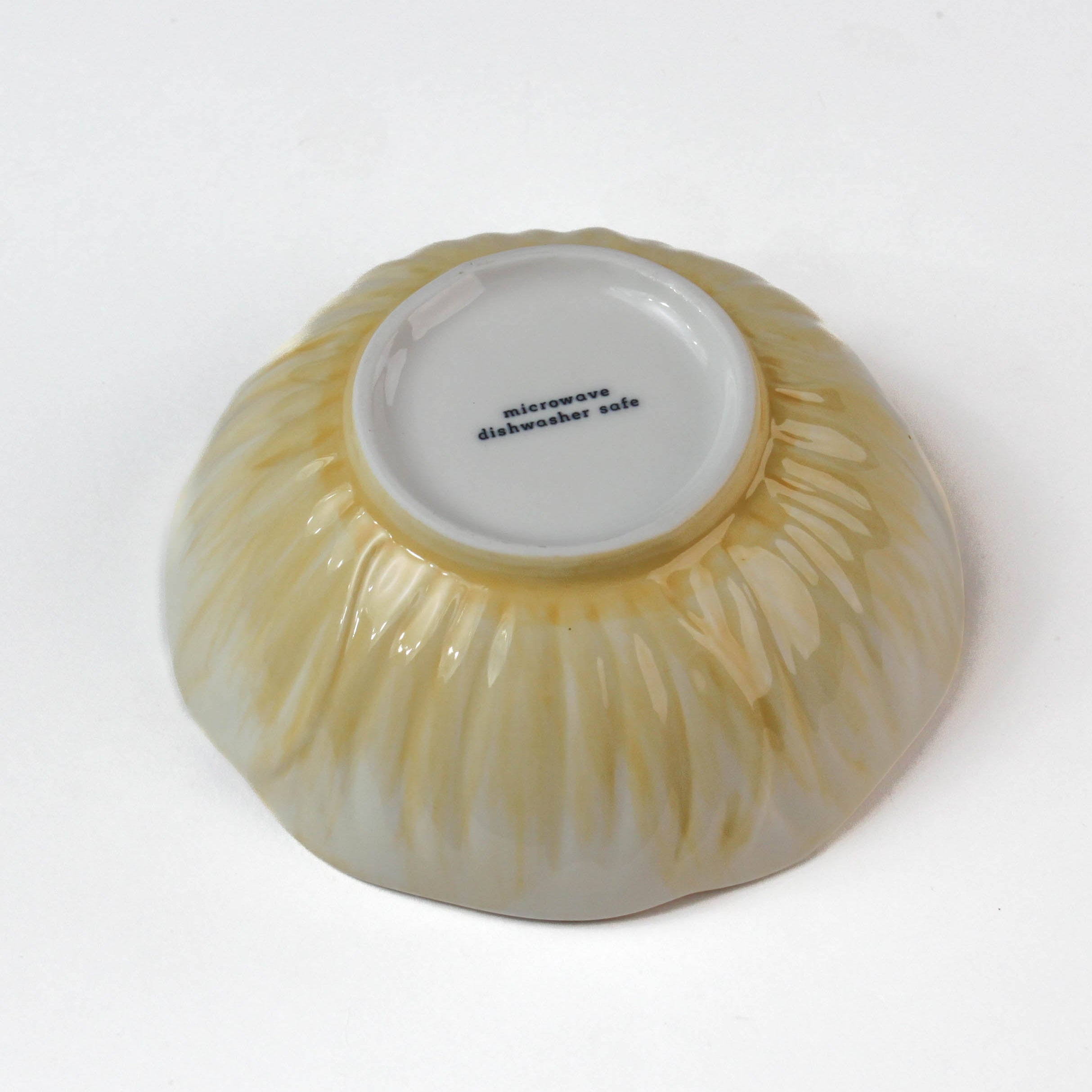 bottow view of a Hand-Painted Yellow Ceramic Flower-Shaped Bowl on a white background