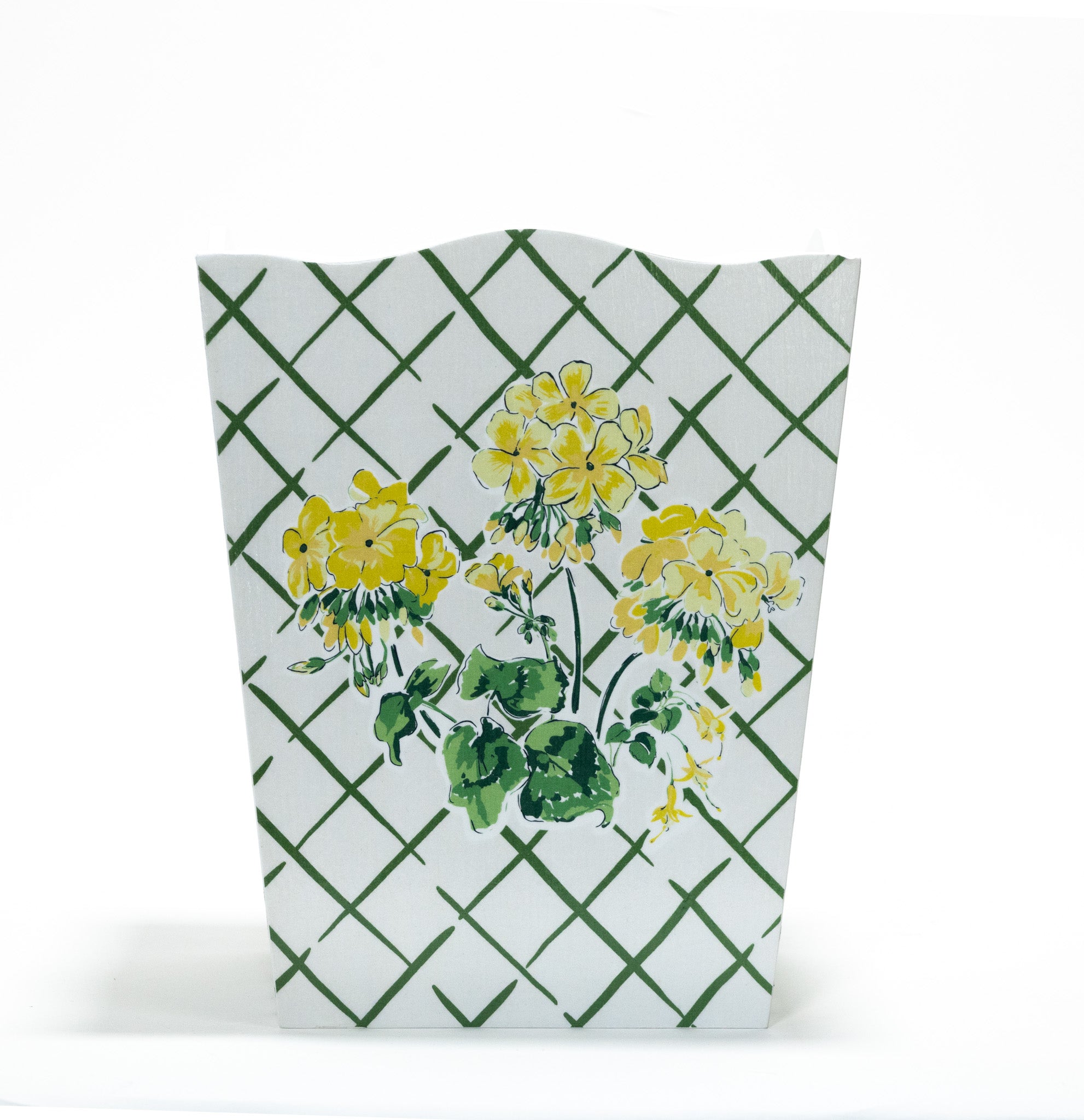 a white and green floral wastepaper basket by madcap cottage with a central yellow geranium motif. 