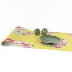 Yellow pink green floral paper table runner styled with decorative cabbage bowls.
