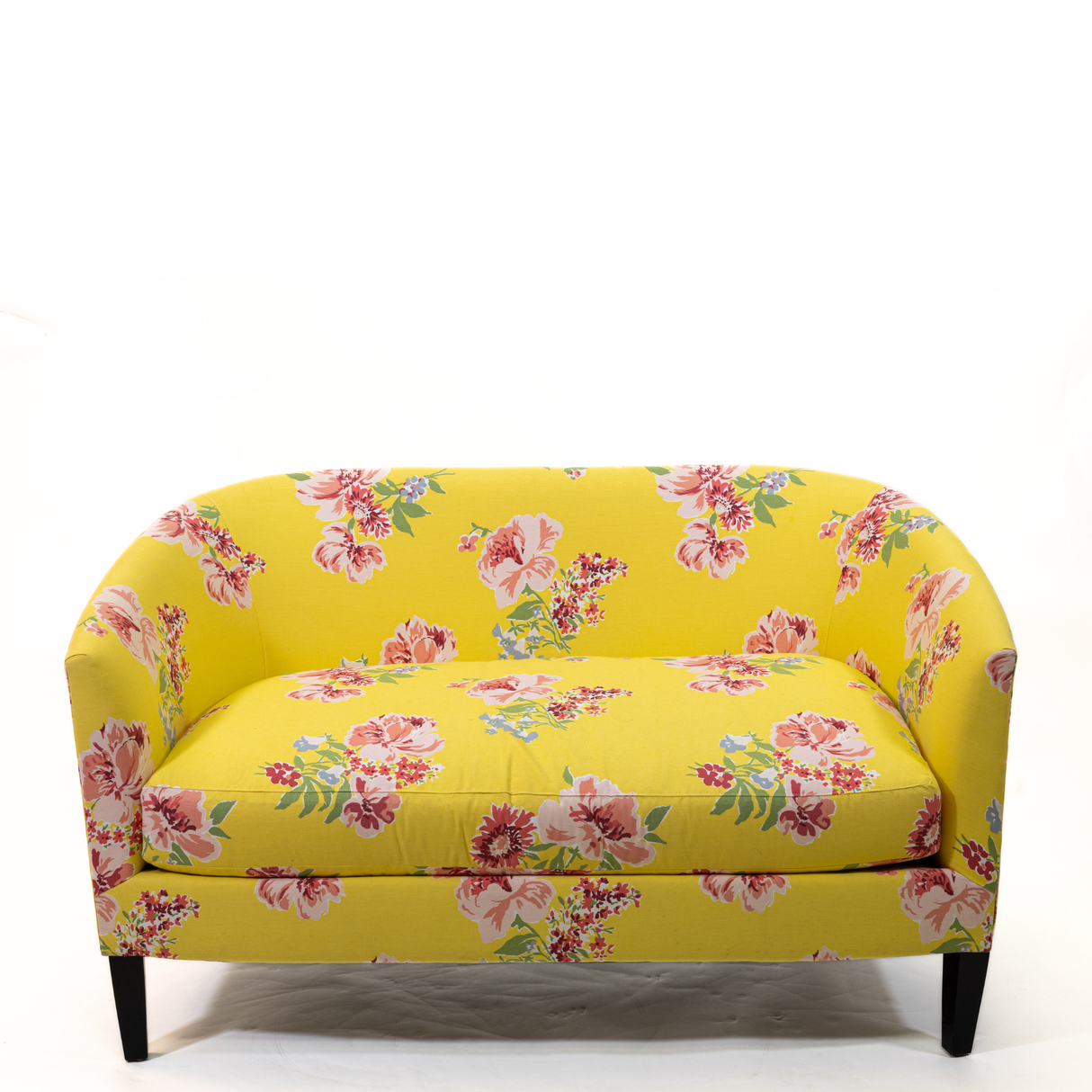 a yellow vintage floral loveseat