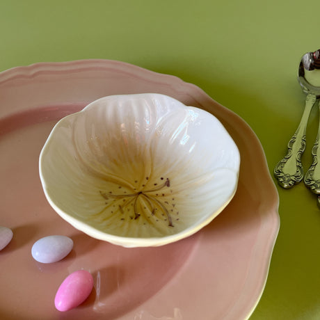 yellow flower shaped bowls resting on a pink plate