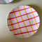 yellow and red ceramic plate