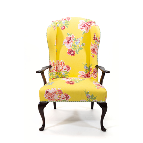 a yellow vintage floral armchair
