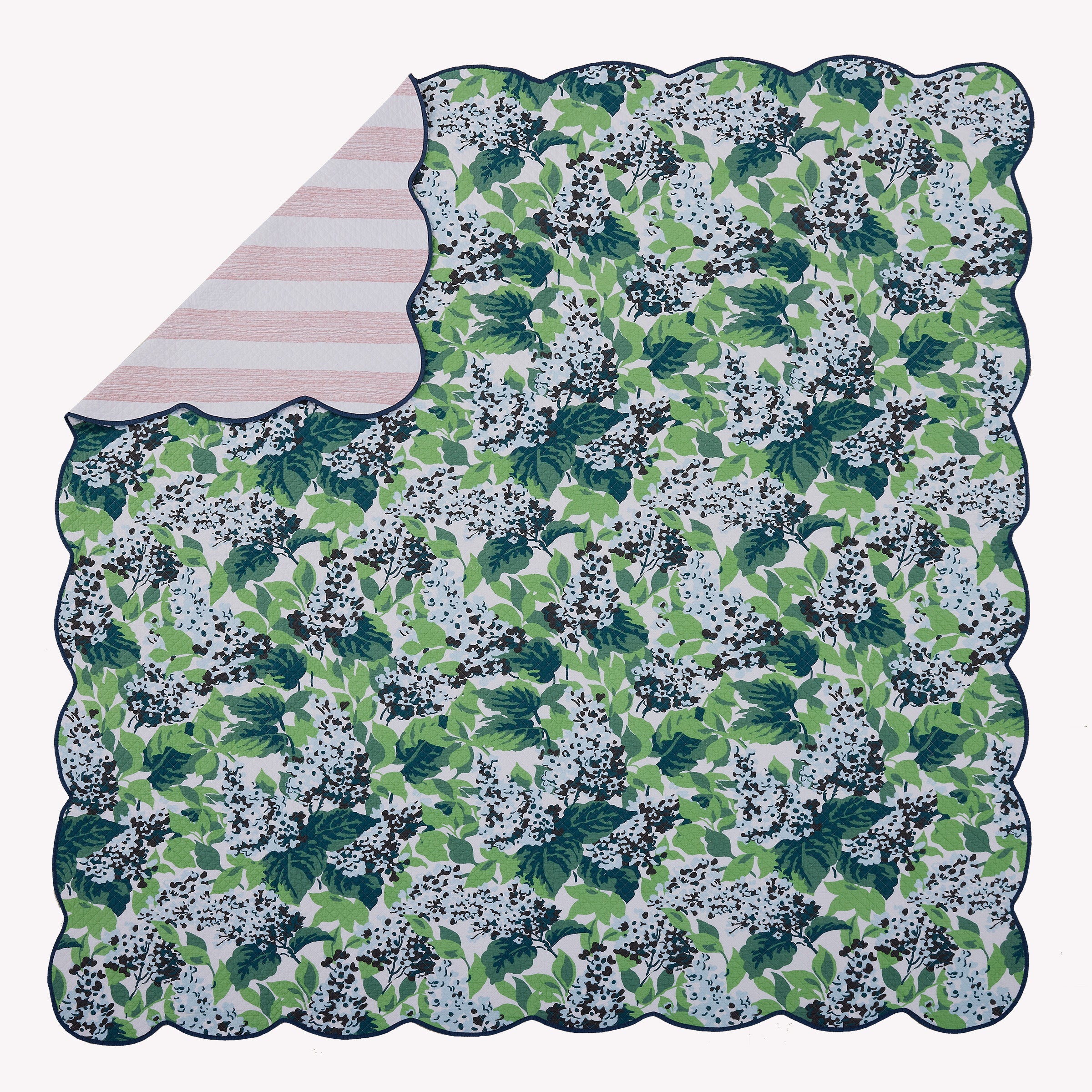Flat view of the Bar Harbor 3pc reversible bed set showing a corner of the reverse pattern.