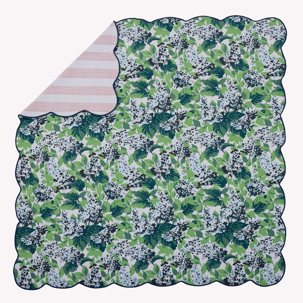 Flat view of the Bar Harbor 3pc reversible bed set showing a corner of the reverse pattern.