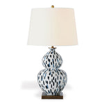 A blue and white table lamp with a blue and white base and white lampshade