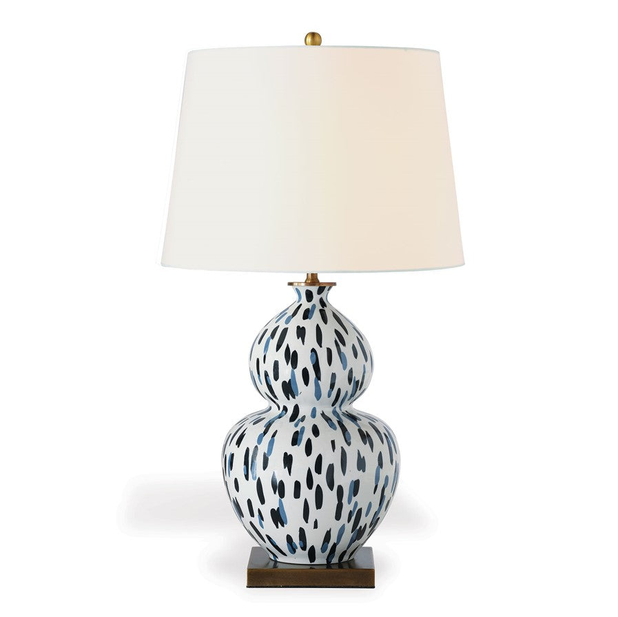 A blue and white table lamp with a blue and white base and white lampshade