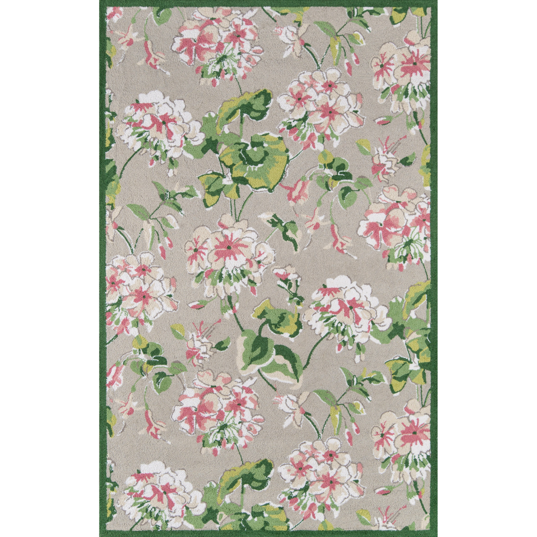 A pink and green rug with a pink, white and green floral pattern on a grey background. 
