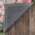 Reverse side of a pink and green rug