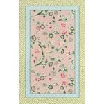 Pink and green rug with pink and blue floral centre motif and green geometric border