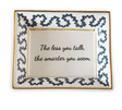 Madcap Cottage blue and white trinket tray with a gold border and a saying that says The less you talk, the smarter you seem. 