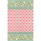 A pink and green rug with a pink lattice center and green border on either end.