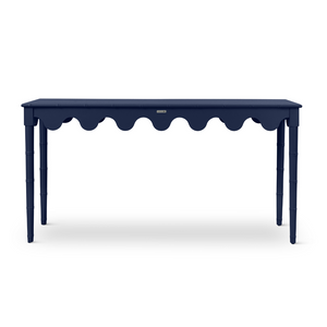 a navy blue console table with scalloped edges