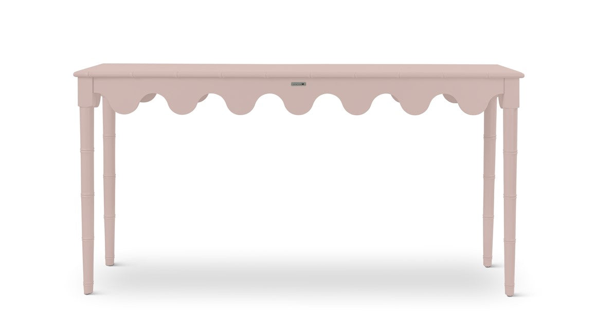 a pink console table with scalloped edges