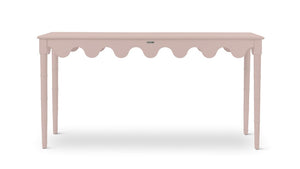 a pink console table with scalloped edges