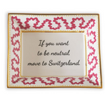 Madcap cottage pink and white porcelain trinket tray with a gold border and a saying that says If you want to be neutral move to Switzerland.