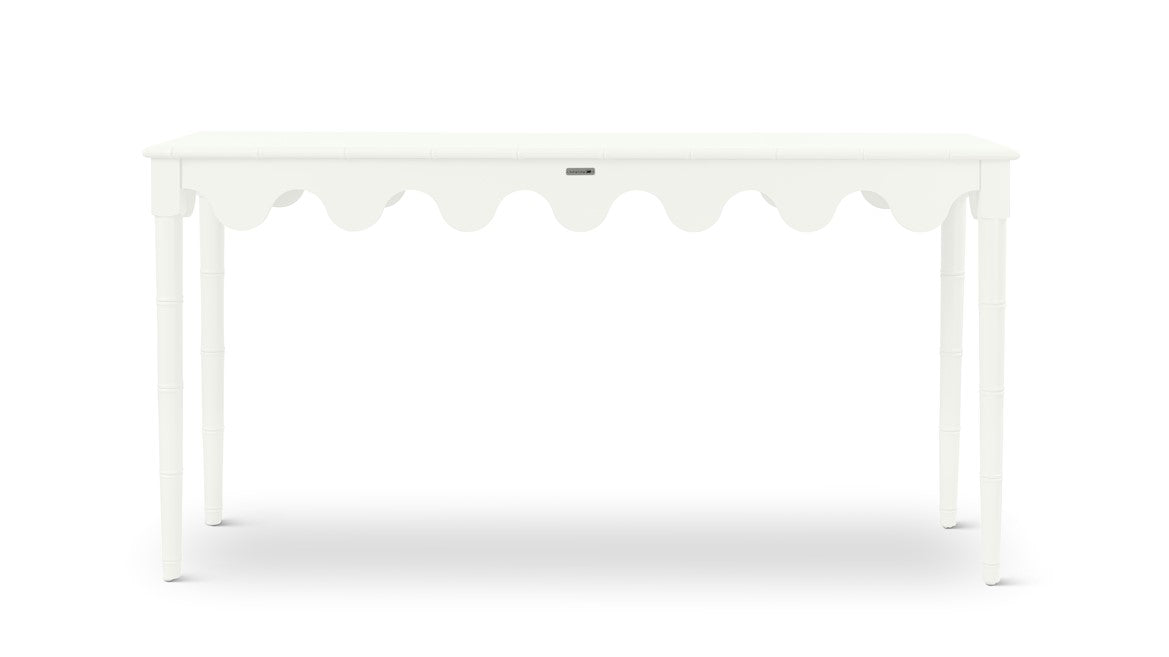 A white console table with scalloped edges