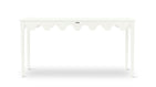 A white console table with scalloped edges