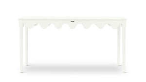 A white console table with scalloped edges
