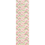 A long rectangular pink and green rug in an abstract print
