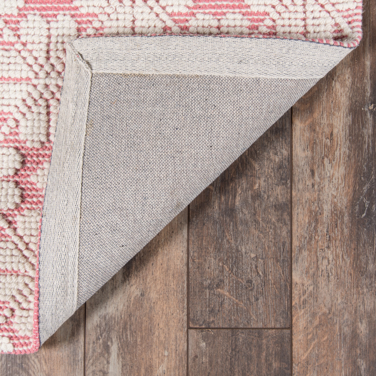 Seville wool pink and ivory patterned flatweave area rug with subtle woven motif and textured design.