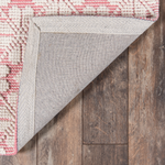 Seville wool pink and ivory patterned flatweave area rug with subtle woven motif and textured design.