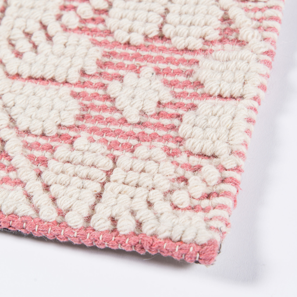 Seville wool pink and ivory patterned flatweave area rug with subtle woven motif and textured design.
