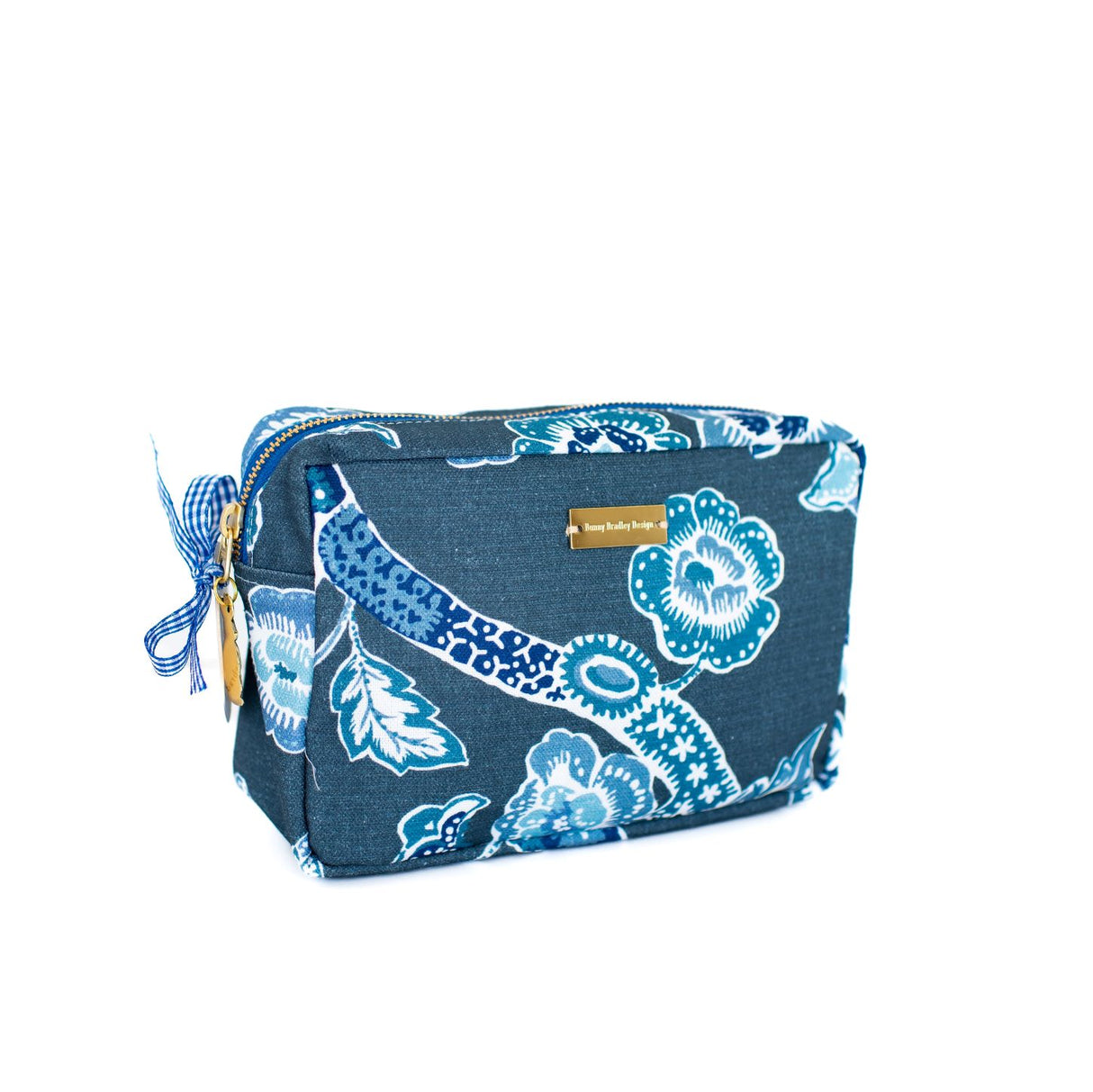 Silhouette image of Temple Garden toiletry bag in navy blue features light blue floral motif.