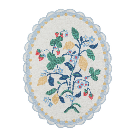 An small oval scalloped rug with strawberry and floral motifs