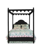 a black four poster canopy bed